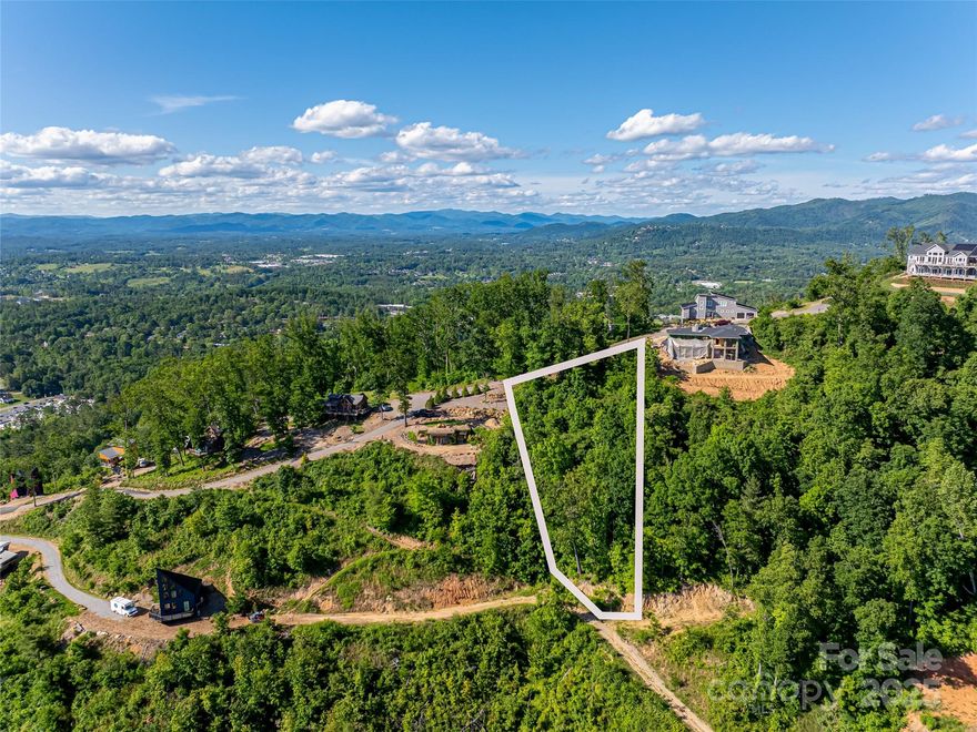 If you are looking for the perfect building lot with spectacular long range views, look no further. Situated in the pristine gated community of Serenity just minutes from downtown Asheville and Weaverville. This lot features amazing sunset views, utilities in place, paved road, and one of the last remaining building lots. Build your dream home today with million dollar views in the heart of the Blue Ridge Mountains. You can have tranquility and adventure right at your front door. Enjoy all that the North Asheville area has to offer with restaurants, breweries, live music, hiking, and the arts. Schedule your showing today!