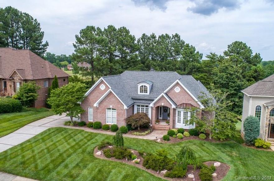 Prestine custom home on the signature 9th hole of picturesque Verdict Ridge Country Club. Expansive view of fairway, lake w/  fountains, &  clubhouse from  deck & screened in porch.  Fully updated w/ new hardware & lighting, newer roof, HVAC & major appliances.  Heavy mouldings highlight the quality of interior finishes.   Master on main level & striking palladium windows in great room  fill your home w/ sunlight. Four bedrooms & office, an oversized garage & over 500 sq.ft. of workshop/storage.