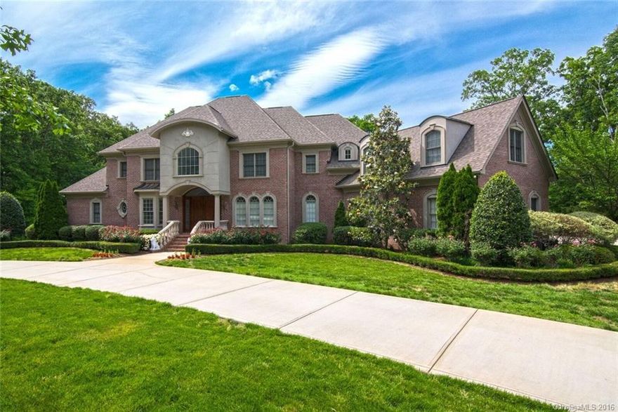 Luxury estate home on a private 3.1acre lot within the highly sought after gated community of Sedgefield in Waxhaw. Enjoy the tranquil setting with water views of one of several ponds within the community. Features include: 4 fireplaces, wine room, Subzero refrigerator & freezer, double ovens, 12-30ft cathedral ceilings, theater room, elevator, fitness rooms, 2 balconies, 2 covered patios, and a level & private backyard perfect for a custom pool. Lower level includes kitchenette & outdoor access
