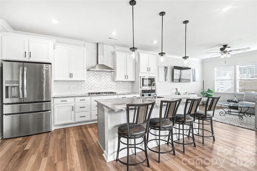 Built in 2023, this 3-bedroom, 2.5-bath LoSo townhome offers over 2,000 square feet, more than $65,000 in builder upgrades, and a layout that’s wider than most other townhomes. The open main level flows easily between the kitchen, dining, and living areas, creating a space that feels more like a detached home than a typical townhouse. The kitchen centers around a large island and includes a gas cooktop, Energy Star appliances, and a walk-in pantry. Upstairs, the primary suite features an oversized walk-in closet with an extensive closet organization system and spacious bath with dual vanities, while two additional bedrooms and a loft provide flexibility for a guest room, a home office, gym, or second living area. A true side-by-side two-car garage adds everyday convenience and extra storage. mart home upgrades include a smart garage, thermostat, lighting, oven, and Ring doorbell. In addition to the patio, the home benefits from a larger deeded lot than many townhomes in the community, offering a bit more breathing room outdoors.