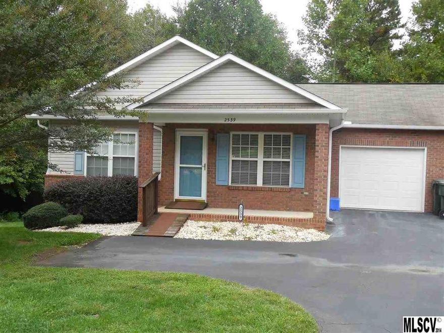 All hardwood floors except baths in this 2 bedroom, 2 bath, all brick townhome. Dues only $80 per month. Range, dishwasher, microwave & refrigerator remain. Excellent condition. Garage has shelving plus extra shelving in storage room. Two doors access the deck. Backs up to the woods, this townhome has privacy. Walk-in crawl space.