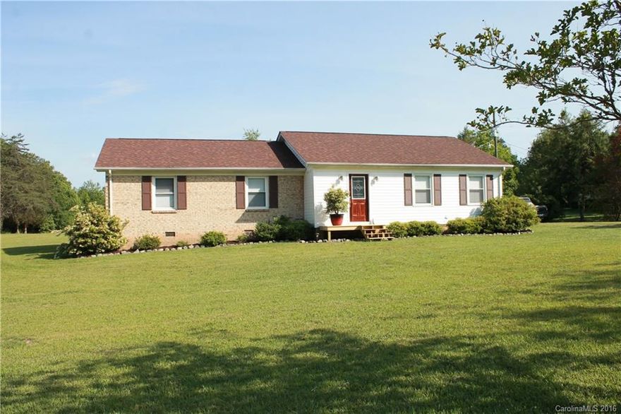 Country charm at its best! Totally updated throughout, 3 bedroom, 2 full baths, new hardwoods, tile & carpeting. Updated kitchen w/granite and stainless steel appliances & work island. Baths w/new vanity and tile. Cozy dining room w/fireplace, step out back for the large patio for entertaining.