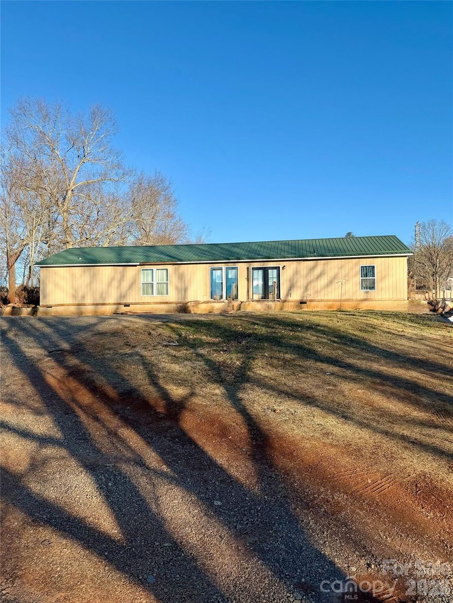 Opportunity awaits just outside the city limits of Canton! This spacious home offers a rare chance for a new owner to step in and complete renovations already started, allowing you to customize the property to your personal vision or investment goals. Built in 2003, the home features 3 bedrooms and 2 bathrooms with just over 2,200 heated square feet of living space, providing functional layout, and generous room sizes throughout. Situated on nearly an acre of land, the primary parcel includes approximately 0.97 acres, offering privacy, flexibility, and room to expand outdoor living spaces. An additional second parcel of approximately 0.084 acres is included in the sale and features a barn. With land, square footage, multiple parcels, and renovation potential all wrapped into one offering, this property stands out as a rare opportunity. Whether you’re searching for a customizable primary residence, a value-add investment, or a rural-feeling retreat close to town, this home provides the space, setting, and flexibility to bring your vision to life. Bring your creativity, your contractor, or your design plans and imagine the possibilities. Properties with this much potential, land, and location do not come along often, schedule your showing today and explore what this home could become.