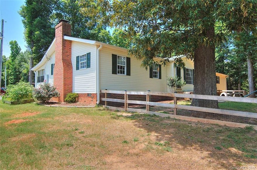 Bring the animals and come enjoy the country life just minutes from 485. This lovely ranch home sits on 5 acres with a fenced pasture in the front and wooded privacy in the back. Already set up with chicken coops and animal shelters it would be perfect for a small farm.  The partially finished basement (not included in sqft) could be used as an office or bonus room. The large over sized garage would be perfect for a shop or man cave and it has an almost brand new RV/Camper Port MOTIVATED SELLERS