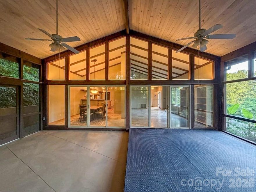 In 1971, this house was FABULOUS - and Tryon was historic. This Holland Brady designed home (look him up if you’re not familiar, it’s a big deal) was a swanky, modern Manhattan penthouse-like interior set on a perfect private ridge to take in the lush mountain views and old growth woods all aroud.  The design and floor plan are elegant. The original appeal remains, and the house is move in ready however new owners may choose to restore some of the mid-mod finishes. This location is a game changer for golfers with the storied, stunning, 1916 Donald Ross course right across the road to play everyday.  It’s incredibly beautiful. Entertain or relax by the wood burning fireplace in the primary living room space with your bar nook.  Enjoy the breeze and views from the dreamy, gigantic screened porch surrounded by nature.  Formal living and dining are also on main level with kitchen. The location is private - on top of a small ridge up a long, impressive stone lined driveway.  Thoughtfully designed for this site, this home is solid and the bones are strong. The glorious clash of old Tryon and modern Holland Brady is still palpable. Really a spectacular location as Country Club Road is not a through street, and for nature lovers it offers endless opportunities for walks and rides, even into town. Square footage is approximate until measured. 2 car attached garage has a temporary divider wall which can be removed.  Sellers / heirs representing the estate are not local so this is an as-is sale with limited property disclosures.