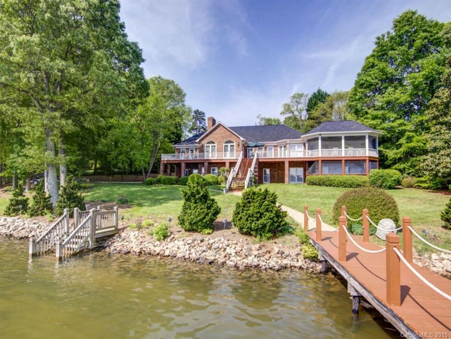 Beautiful brick ranch/bsmt w/huge lake view, minutes from LKN State Park. Deep water w/double covered boat slips & large sun deck. Open floor plan w/recent updates. FP in great room & downstairs rec. 2 screen porches-1 on each level. Lower level heat pump replaced in 2013; roof & lower level BR carpet replaced in 2015. House is set up as 4 BRs; however septic is for 3 BRs. (Lower level storage room enclosed years ago for 4th BR.; septic permit looks as if extra line can be added.)  Very private.