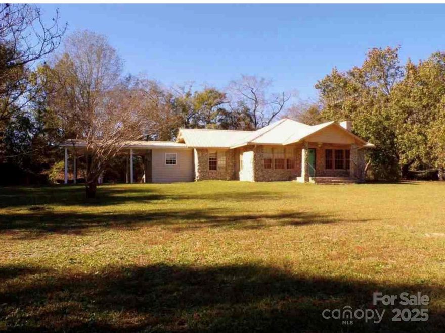 Enjoy the peaceful charm of rural living with this 3 bedroom, 2.5 bath home on 2.27 acres in Bethune, SC. Offering 1,935 sq ft of one-level living, this property features a rock and vinyl exterior, a flexible floor plan, and beautiful natural surroundings.
Step inside to a welcoming layout with multiple living areas, a large kitchen with ample cabinetry, and a separate dining area perfect for entertaining. The generous primary suite and full bath, with two additional bedrooms another full bath and half bath offer comfort and flexibility.
Relax on the property and take in picturesque views of the nearby 25-acre pond, offering a peaceful backdrop for everyday life or your morning coffee. The land is open and usable—ideal for gardening, recreation, or future additions like a workshop or animal structures.
Whether you’re seeking a private homestead, investment opportunity, or move-in-ready home with room to grow, 3929 Timrod Road offers space, comfort, and scenic beauty all in one.