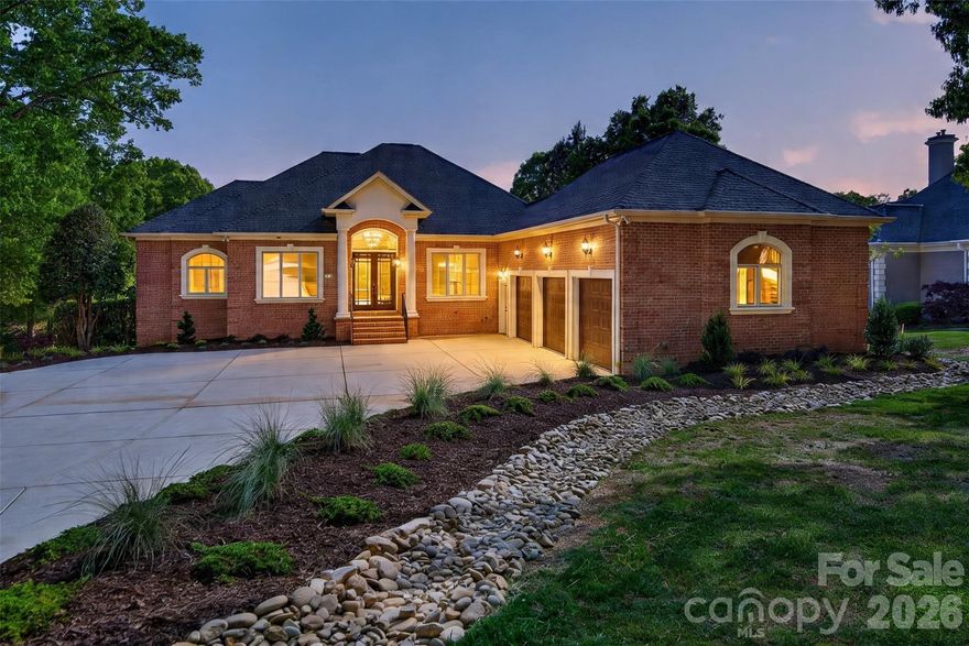 REFINED WATERFRONT LIVING AT IT’S BEST! Meticulously renovated custom full brick Ranch/Basement home on the shores of Lake Norman. From the moment you enter this beautifully renovated and light-filled home, your breath will be taken away! The main focal point of this is the new two-story stone fireplace with built-in bookcases. A great spot for family gatherings or to relax and enjoy your wonderful water views. There is a first-floor office for a quiet workspace. The open and spacious Dining Room gives you ample space for holiday dinners. The light and bright Kitchen has all new appliances (excluding refrigerator), painted cabinetry, built-in bench seating w/storage and an ample breakfast/dining space for morning coffee and informal meals. Off the Kitchen is a large screened in porch to enjoy mosquito-free evenings outdoors. There is also an uncovered porch area for additional outdoor space. Lastly, there is the bright and oversized Owner’s Suite w/sitting area; a great spot to relax and enjoy a great book or simply enjoy your exquisite views. Before you enter the Owner’s Bath, you’ll pass dual walk-in closets. Your bath features separate vanities, a jetted tub and an ample sized walk-in shower. Down the hall leading to the 3-car garage, you’ll reach one of two main level half baths as well as a large and separate Laundry Room with ample storage. Off the hallway you will find the open staircase taking you to the lower level; where you have three ample-sized secondary bedrooms, a full bath with walk-in shower and a spacious Family Room with dual sided fireplace, which opens into one of the lower-level bedrooms. The entire front portion of the basement has below grade storage with expansion possibilities. The rear yard offers a gradual walk down to the covered dock. The rear yard can accommodate a pool.  The quiet cove location is just minutes to open water. DON’T MISS THIS GREAT OPPORTUNITY TO START ENJOYING LAKE LIVING!!!