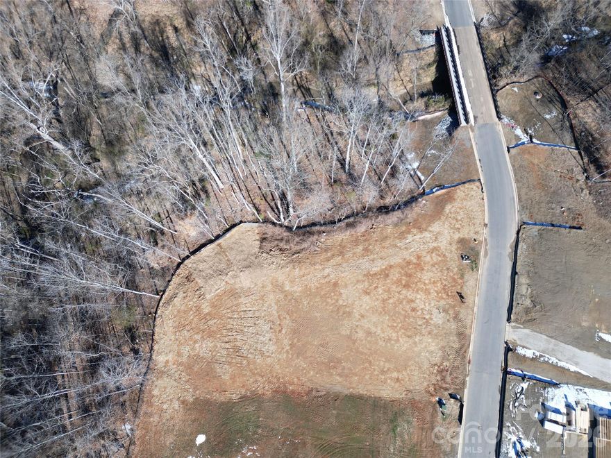 Award winning local Davidson homebuilder Holliday Homes presents this nearly half-acre lot in the ideally located Davidson Woods neighborhood. This property is bordered on the north and rear by almost 1.5 acres of undisturbed and dedicated open space with protected streams and mature forest, a perfect backdrop for what could be the stunning and private back yard of your new custom home.

Surrounded by high end homes from some of the area’s top luxury custom builders, this will be a wonderful opportunity to work closely with the Holliday Homes team and Davidson Architect Nicole Perri on potential plans for this special property. The architectural plans are currently at a stage where this still an opportunity to customize the plans to meet your specific needs and create your dream home.

Enjoy easy access to the nearby Davidson Greenway, and just minutes from downtown Davidson, multiple top-rated schools, and all the amenities the vibrant and special college town of Davidson has to offer.  Plus convenient access to all that makes the Lake Norman area such a wonderful place to call home.