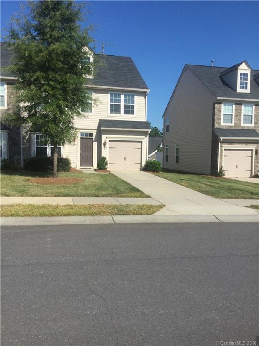 End unit with custom hardwood floors in entry, fireplace, security system.  Master bedroom is large with dual walk in closets, dual vanity, tub and separate shower. Rent includes lawn care, water, across the street from all amenities Berwick has to offer. www.berewick.com. Mins to shopping, dinning, Tanger Outlets, I485. Finished garage with painted floor, your will not be disappointed with all this home has to offer!