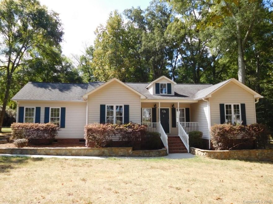 Spacious 3 bedroom/2 bath ranch plan! Open floor plan home sitting on 1.2 acres. New paint, flooring and kitchen appliances. Vaulted ceiling in living room, open to kitchen. Trey ceiling in Master bedroom with walk-in closet. Formal dining room. Private deck with stone patio. Move in ready.