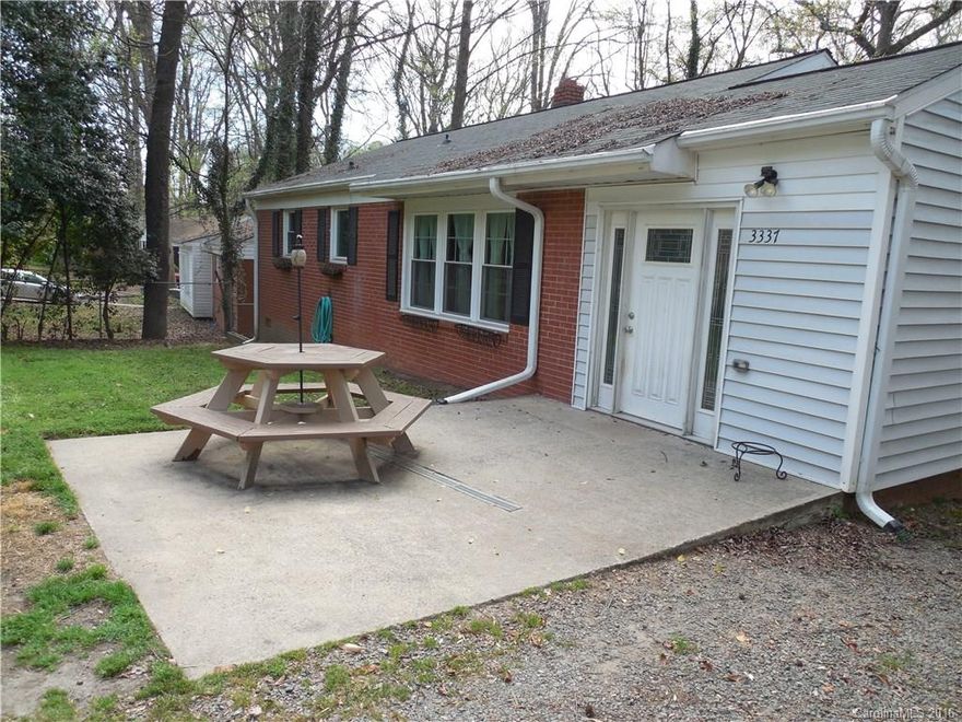 Unique brick ranch with hard to find basement bonus room!  New insulated windows '09, new roof and screened porch '13. Custom concrete table seats 4 with extra storage, slate backsplash, and stainless appliances (fridge remains) in the open kitchen. Custom concrete floor in entry with window box & closets, and spacious stamped concrete patio in the HUGE privacy fenced backyard. Front yard is also fenced! 2nd full bath downstairs with laundry (w/d remain) and fireplace in bonus. Great location!