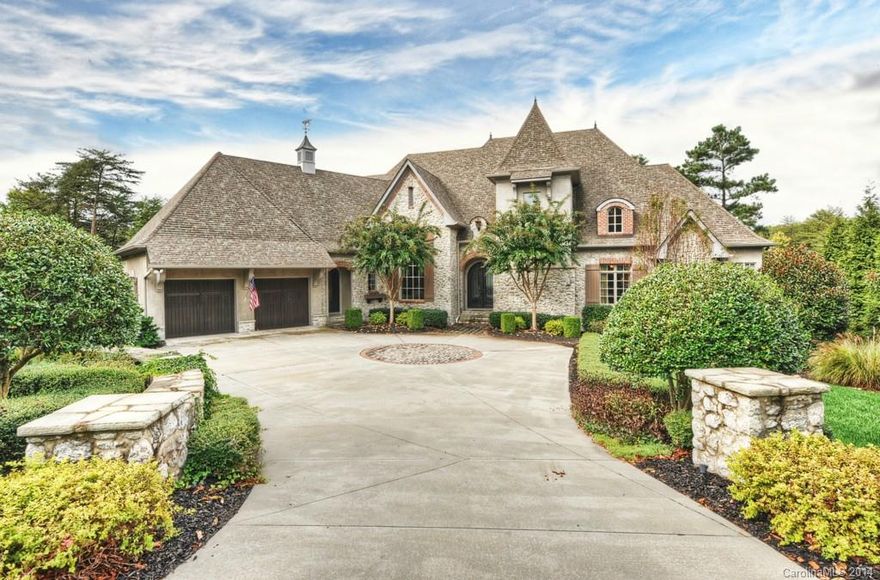 Hand Cut Stone *& brick grace the exterior of this premier Waterfront Estate. Located on a cul-d-sac, this lot offers the best of all waterfront desires, spectacular sunset views & a quiet, large deep cove.  The home has all those special touches you would expect in The Point, including, guest room suites, large master suite, 3 fireplaces, gourmet kitchen w/office, 2 laundry rooms, full entertainment basement w/kitchen & wine cellar. In-ground infinity pool.  Outdoor living w/dock, lift & deck.