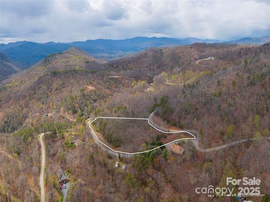 Don't miss a rare opportunity to own land close to WNC University, Sylva, Franklin, Waynesville and all that the Great Smoky Mountains National Park has to offer.  Almost 4 acres in a community that offers only larger lots to allow privacy for everyone.  Between Waynesville and Cullowhee just waiting on you. All you need is the imagination to create a place where you can still have a small or large short term rental or a private estate, with a building restriction as small as 600 sq. ft. a tiny house is an option maybe or as big as you and the architect want to imagine.  There are beautiful homes on past this lot on Quest Ridge.  As long as it is not a manufactured home, the HOA will look at plans that follow the county guidelines to obtain a Certificate of Occupancy. If you like your privacy or like being in the area, take a look and give me call and let's talk.