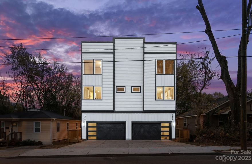 Step into urban paradise with this new construction by Northway Homes Signature Series. Discover urban luxury in this 3-story, 3-bedroom, 3.5-bathroom duet located in the heart of Charlotte. The residence is thoughtfully planned for convenience and modern living. With walkability to nearby Optimist Hall, you'll have the best of the city at your doorstep. And let's not forget the 2-car garage, site built hardwood floors, and sleek stainless steel appliances. Boasting a rooftop deck that offers views of the city. Additionally, there are two other decks and a meticulously designed backyard oasis. This residence promises a blend of luxury and urban living, defining the essence of NoDa's vibrant lifestyle.