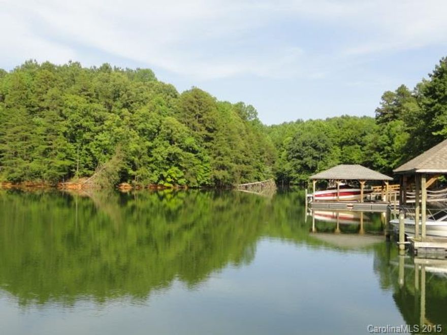 Sprawling WATERFRONT estate on LKN. Upgrades galore! Main level Gourmet Kitchen with Island and Viking range, Formal Dining, Hardwoods, 2-story Great Room with stacked stone fireplace, Office and Living Room.  3 Bedrooms upstairs including Master Suite with Garden Tub. Lower Level Rec Room with fireplace, Wet Bar and Bedroom with Full Bath. Enjoy the views from the Deck & Lower Level Patio, Pier with Dock, Irrigation and Lush Landscape. No Smoking and No Pets. Lawn maintenance is included!