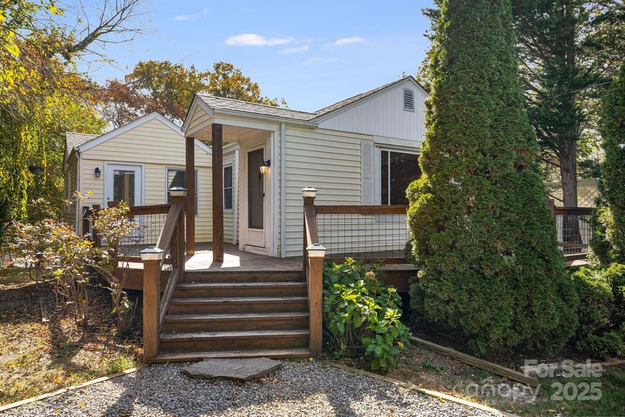 Inviting 3-bedroom, 1-bath home offering 1,169 square feet of comfortable living space. Enjoy the warmth of hardwood floors, a spacious living area, and a large deck perfect for entertaining or relaxing outdoors. The fenced-in yard offers room to play or garden, while the basement garage and extra storage space add convenience. With plenty of parking in the driveway, this home blends functionality and charm — all in a great East Asheville location close to the golf course, local restaurants, bars, and grocery stores.