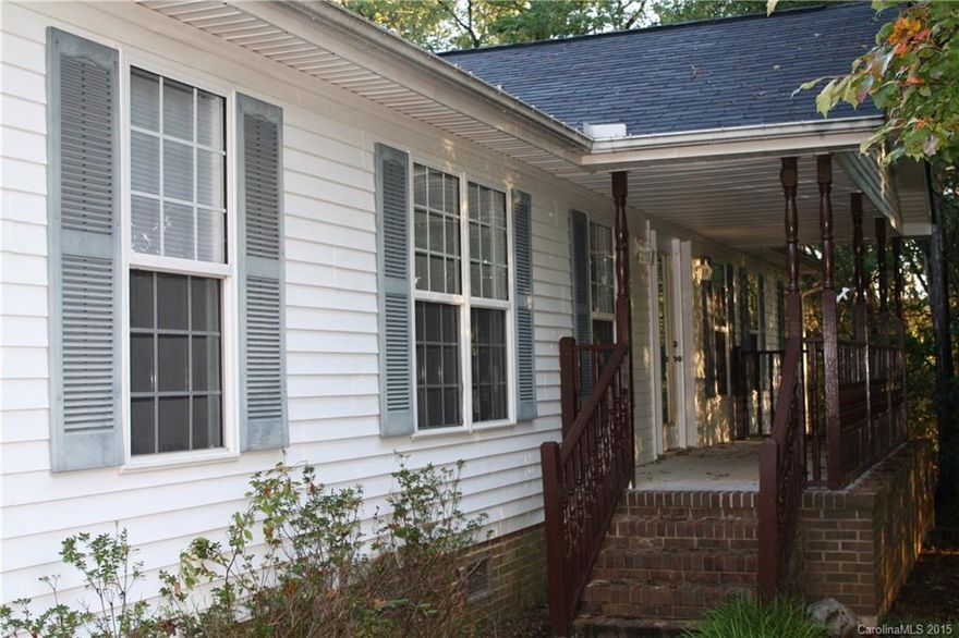 Enjoy country living with "Uptown" conveniences. Just 10-20 minutes from Ballantyne, Fort Mill, Lancaster...yet surrounded by 5.4 wooded acres. Oversize family room, lovely kitchen, 3BR, 2BA, garage w/workshop, fenced backyard.