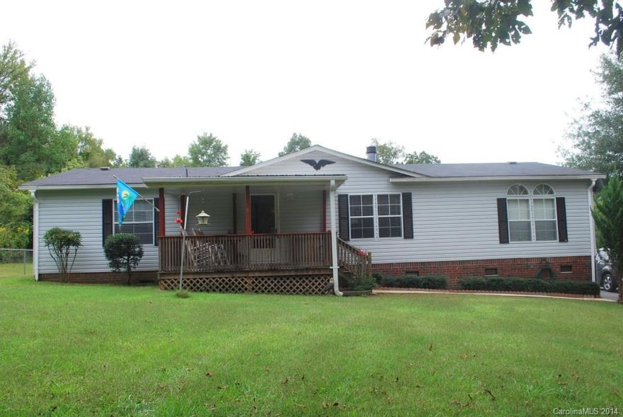 Well Maintained 3BR/2 BA home on 1.8 Acres.  Formal Dining & Kitchen w/Laminate Flooring, an Island & Good Cabinet & Counter Space.  Split Bedroom Plan, Master w/Private Master Bath.  Rec Room or Man Cave off of Laundry Rm.  Covered Front & Back Porches. 2-Car Carport & RV or Boat Covered Parking. Outdoor Building Office could be a business (currently used for a Sewing Shop) 12X20 Storage Barn w/2 Lean Two's, one is Enclosed for Equipment Storage.