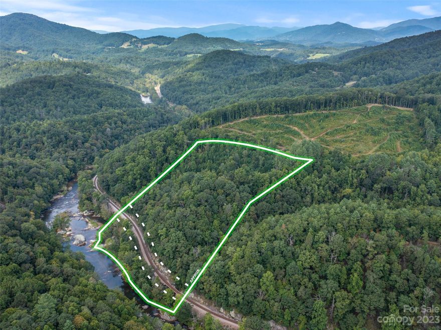 Beautiful 9 acres in the Snow Creek area of Bakersville.  Enjoy the mountain views and frontage on the North Toe River!  This land is one of the few remaining places with unobstructed views of the Milky Way! If you want to be even closer to the Milky Way, just beyond the property is the Dark Sky Viewing Center by Mayland Community College!  Multiple areas for building and how about a spot at the bottom of the property so you can catch your dinner from the North Toe River?  To fully appreciate the natural offerings, everyone is encouraged to walk the property and note their favorite features!