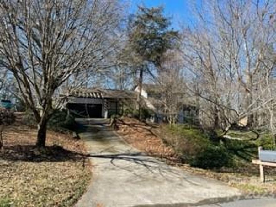 Excellent location in South Charlotte. Unique contemporary home with 2-car garage on .49-acre lot. As you enter the foyer on the main level there is a large owner suite with full bath. A few steps down from the foyer leads you to the great room with a beautiful gas log fireplace and a large dining living area. To the left on the lower level is a half bath and the spacious kitchen with stainless gas range & oven, refrigerator, and microwave. The kitchen cabinets are numerous and the center island with granite countertop can host guests on bar stools. Nearby is a large breakfast area with cozy gas log fireplace that leads out onto a wonderful sunroom overlooking the incredible wooded backyard that is fenced-in with stone walkways throughout. Off the sunroom is a sizable deck that leads down to the yard. Make note of the kid’s sky fort. On the upper floor are two additional bedrooms and a full bath. Property is sold as-is.