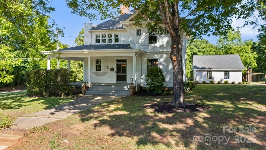 Historic Character Meets Modern Comfort just a short 5 min walk to downtown Mooresville! Step into timeless charm w/ this 1904-built beauty—constructed by esteemed Mooresville physician, Dr. Nicholas Moore. This gem may not carry an official historic title, but every detail—from the rich heart pine floors to the handcrafted wood wainscoting & trim, blending old-world elegance w/ thoughtful modern touch. Including a kitchen/ bath reno (2021), spacious 2-car detached garage (22'9" x 22'9") built in 2020, Furnace (2019), A/C system (2016), plumbing (2013), electrical rewiring (2012), a newer roof installed in 2022, fresh exterior paint 2025 & 4 original fireplaces. Set on an unheard of 0.69-acre flat lot, this home is truly one-of-a-kind for downtown living. Whether you’re dreaming of gardens, outdoor entertaining, or even expanding, this kind of land is nearly impossible to find in this location. A $2,880 structural engineer report completed—full details available for prospective buyers.