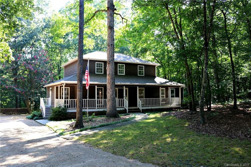 Charming home in peaceful cul-de-sac on over 3.5 acres! The kitchen boasts SS appliances, breakfast nook and separate formal dining room. Cozy stone fireplace in LR. Hardwoods throughout majority of main floor. There is a master on the main floor and another upstairs, both with en suite baths! The spacious front porch and huge back deck are perfect for relaxing, BBQ's and entertaining. The detached garage features an attached 2nd living quarters with full bath and kitchen.