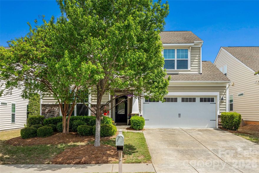 Welcome Home to 1521 Deer Meadows Drive! Located in the sought after Lawson neighborhood.  This lovely 1.5 story home boasts 2,665 square feet of living space, a 2 car garage and TWO relaxing outdoor areas you MUST see! The best part?  This home has lawn care included in the HOA dues! Fresh neutral paint 2026.  All new laminate wood floors 2026. Custom design details throughout. A covered entry greets you as you enter into the spacious foyer.  The open floorpan features main level Primary bedroom with ensuite bathroom, a guest bedroom and full bathroom,  and an office with French doors. The laundry room and drop zone off the garage are functional and provide great storage.  A side patio and fire pit area area come next as you move through this popular floorpan.  The perfect spot for relaxing or grilling.  The large kitchen has granite countertops, tile backsplash and stainless steel appliances.  The oversized island and additional dining area provide plenty of room for a crowd! The open concept living room with stone detail fireplace is adjacent to the kitchen and is the perfect place for gathering! The screened porch at the back of the home is a tranquil retreat and can be accessed from the Primary bedroom as well. The large Primary bedroom with ensuite bathroom has double vanities, stall shower and a separate water closet.   The closet in the Primary bedroom is large and has added shelving for organization. Upstairs you will find a large family room, and additional bedroom and full bathroom!  The large closet has a shelving system to keep things organized and the additional unfinished storage space behind is a big PLUS! Lawson has resort style amenities including: multiple pools, playgrounds, fitness centers, pickleball and tennis courts, walking trails, organized community events and more!