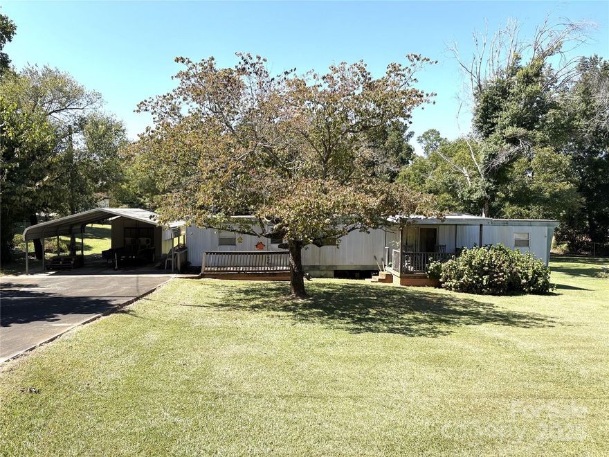 Beautiful lot in Buford school district ready for your new home. 1965 mobile home on property is of no value, cannot be accessed, and will need to be removed. Location has concrete drive, double detached carport and 10x8 storage building and has had connections for county water, Duke Energy and natural gas. Zoning is MDR which allows stick built or modular homes only.