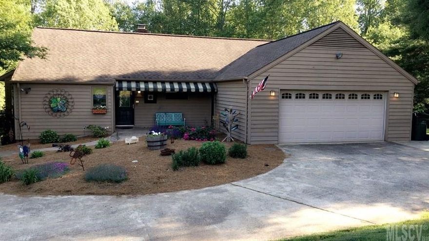 Beautiful 3 bedroom 3 bath home(possible 4th bedroom in basement) in desirable Northmoor subdivision. Convenient to shopping, restaurants, and schools. Situated on two lots, house provides private backyard bordering a creek and lovely, mature trees. Underground dog fencing, deck and sunroom make this home family friendly for everyone!! Hardwood floors on the main level, exposed brick and a large loft which would make a wonderful kids space or office. The main level has sunken living room and open concept kitchen/dining.  Master bedroom with large walk in closet, bathroom with large garden tub and double sinks. Two additional bedrooms are on the main level and another full bath.  Finished basement is phenomenal extra space with possible seperate 4th bedroom, teen hangout, or man cave. Situated on a corner lot, this house is perfect for those wanting to be close to town yet feel like they are in the country. Don't miss an opportunity to view this spectacular home. It won't last long!!!