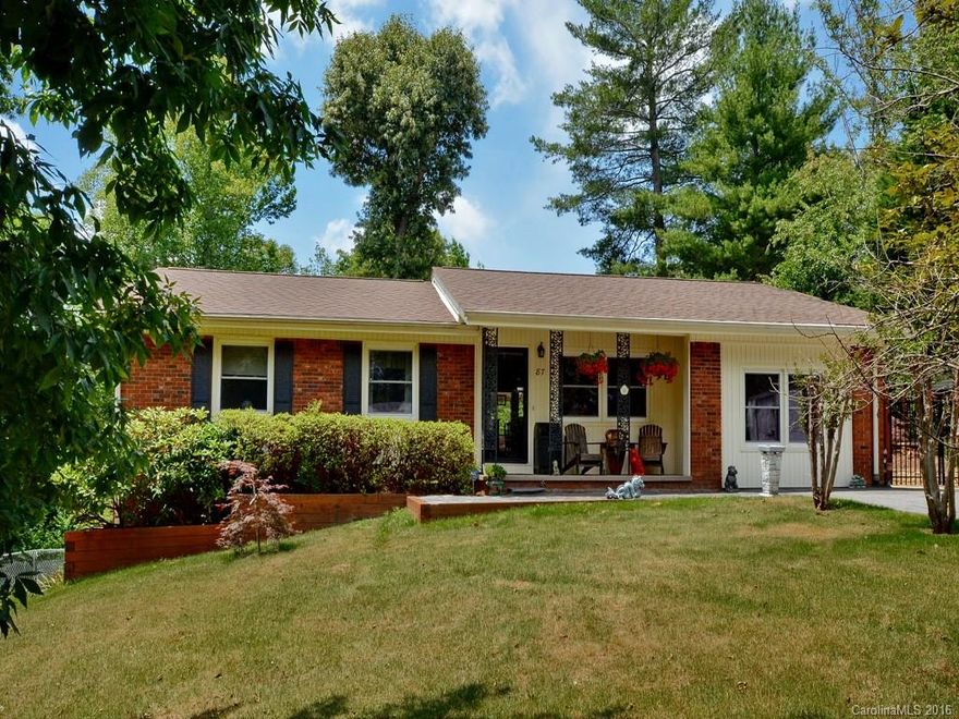 Charming well maintained brick home in lovely tree lined neighborhood!  Beautiful cherry wood floors, updated kitchen cabinets with unique style; enjoy cozy den fireplace with slate flooring; finished basement for office or playroom.  Large, level yard with fruit trees and nice landscaping; Fenced and ready for your family & pets!