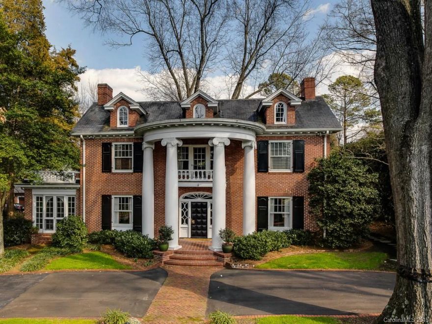 Classic brick Georgian built in 1920. 10' ceilings down, 9' up. Totally updated in keeping with charm of the era. 2-story carriage house/garage and covered patio with built-in grill. Electrical updated in 2004, new roof 2002, recently painted inside and out.