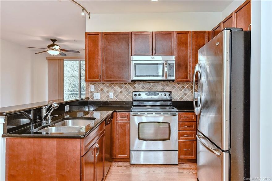 Wonderful Dilworth location, walk to hospital, park , restaurants and shopping! Split floorplan, stainless steel appliances , granite in kitchen.  Open , bright and pristine! Deck overlooks Latta Park.