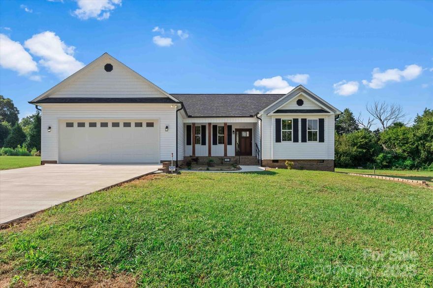 Beautiful Custom New Construction Ranch on .65 acre lot in the desirable West Rowan area! Attention to detail with features that include custom cabinets, granite counters, ss appliances, double oven, eat in island in kitchen; gorgeous ceiling beams in open area of the kitchen, dining, & great room; custom built gas log fp; primary BR has wainscoting, separate vanity/sinks & a walk-in tile shower and exit to screened porch; Split floor plan w/Large secondary BR's w/hallway of custom cabinets for storage; Real hardwood flooring throughout living area & bedrooms; tile in baths; half bath & laundry area w/sink at entrance to garage; screened porch & patio perfect for relaxing & entertaining; covered front porch w/wood posts; 2 car garage and concrete drive; & tankless water heater. This quality home has it all!! $3500 lender credit towards closing costs available with preferred lender!
