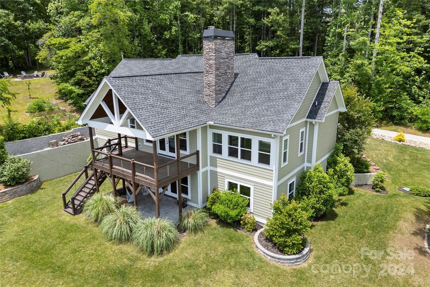 Views, views, views! Completed in 2019 and boasting 3,500 + square feet, this thoughtfully designed arts and crafts style home is ready for it's new owner! Offering year round southern facing mountain views, this lot is considered one of the best in the Old Orchard community. As you approach the house from the community road, you will be greeted by a nearly 1,000 sq. ft. 3 car garage that also features a workshop. Step inside to an open living area featuring large windows, vaulted ceiling and large stone fireplace. As you turn the corner, you will notice the functional kitchen which features quartz countertops, herringbone subway tile backsplash and large island. Rounding off the main level you will find- large primary bedroom offering mountain views from your bed; Primary bathroom with tiled shower; Additional bedroom/bathroom; Laundry room. The basement consists of 2 bedrooms/2 bathrooms, office, large rec room and utility room. Exceptional community and opportunity!