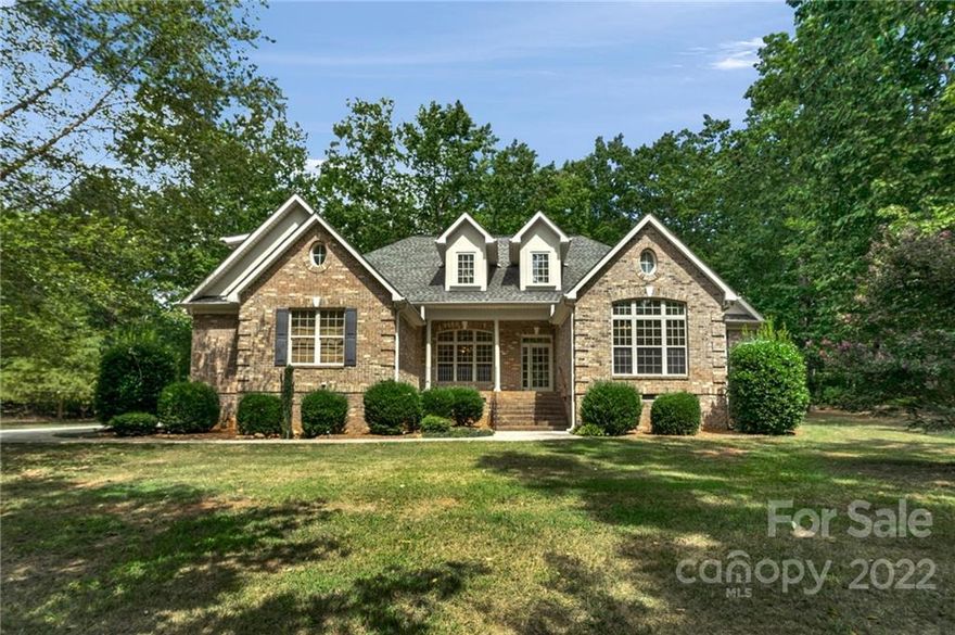 MOTIVATED SELLER of this 3 bed 3.5 bath, full brick, 1.5 story home with recently re-finished hardwoods, Interior paint, professionally cleaned inside and out.  Ready to move in home in the West Pointe neighborhood in Clover.  Property has a 2.33 acre corner lot that is surrounded by trees for added privacy.  Home has a 2 story Foyer in the entry and Great room that leads to an open floor plan for large family gatherings.  No carpets on the main living level.  All hardwoods or tile.  Recently added hardwoods in 2 bedrooms on main.  Primary Bedroom is on main with ensuite bath with garden tub and walk in closet.  Upstairs has a bonus room with a possible bedroom with an ensuite completely updated bathroom that could be a second primary bedroom.  Seller is offering a Flooring Credit to replace the Carpet upstairs. Outside living space has covered back porch leading to brick patio with fire pit and stone bench.  Home shows intense pride of ownership.  Very well maintained property.