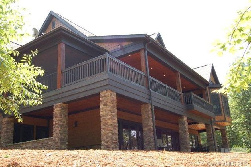 This home is immaculate!  Want it all?  Here it is.  Look right at Dobson's Knob and huge water views from this point lot in Crescent's most sought-after 1780 Community.  Walk comfortably to the dock with a deck and 40' of water depth.  Enjoy almost 5000sf of heated space with another +/- 1365 feet of decks, patios, and a beautiful screened porch.  Need room for a truck or boat?  There's plenty of space in the huge triple garage.  Home includes 3 fireplaces, huge master suite on main, 4 bedrooms, 4.5 baths, media room, game room, bar, keeping room, and a completely self sufficient bonus room with office, full bathroom, and separate outside entrance. There is a view from almost every room. Want more? Take an easy shortcut on the trails to Camp Lake James, the premiere amenity on the lake.  Your membership comes with this purchase.  Camp Lake James includes a 2 pools, jacuzzi, tennis courts, activity center, restaurant, amphitheater, fitness center, game room, and more.