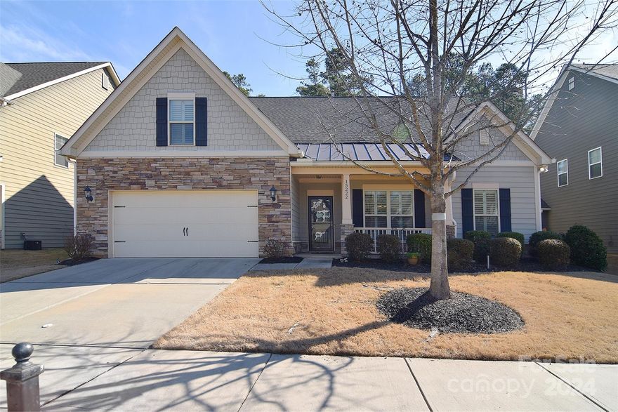 Desirable McKee Ridge, a pocket community located in The Palisades area, built by Knotts Builders.
This exceptional home features the  primary bedroom including deluxe bath with double vanities, garden tub and separate shower and two additional bedrooms on MAIN level. The open floor plan living connects the kitchen great room showcasing SS appliances, double wall ovens, over-sized island, quartz counter tops, and walk in pantry with family room which boasts a gorgeous stone fireplace and wood beams. Delight in a more formal entertaining experience in the dining room with a tray ceiling & chair rail moldings. Read or relax in the sun room or move onto the screened in porch to enjoy the private fenced in back yard and wooded lot. You'll find a large private bonus/bedroom upstairs, a full bath, and an office. All this with engineered hardwood floors throughout with tiled baths and laundry. No carpet! This floor plan combines space, versatility and privacy for everyone and everything.