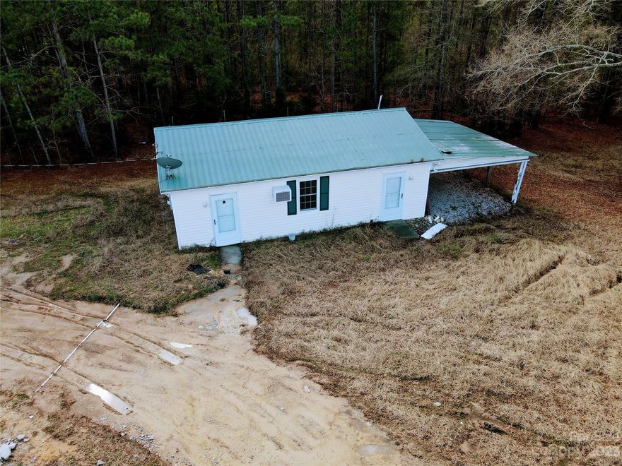 The possibilities are endless! 
This will be a GREAT investment opportunity, or your chance to build a new house and have a rental/ guest house! This is 2, 1 acre (2 acres total) lots that have already been subdivided. 1 of the 1 acre lots has a small house AND a foundation for a new construction to be built. The house plans for that house can be provided (Front elevation in associated docs). Here's your chance to build a new construction and make updates to the existing house to use for your guest, or rent out the small house for extra income. The existing home is being sold in as-is condition. Call today with any questions or to schedule a showing!