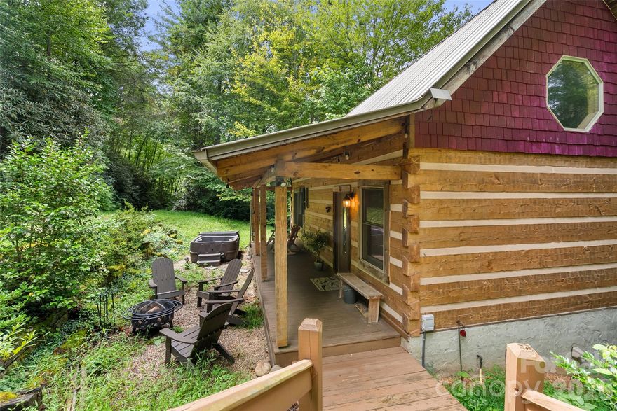 Mountain Retreat with Endless Possibilities - Discover rustic charm and modern comfort in this beautifully crafted hewn log cabin, nestled on 10 private acres with its own hiking trails. Whether you're seeking a peaceful escape, a smart investment, or a full-time residence, this property offers unmatched versatility and serenity. Located between Shelton Laurel and Little Laurel creeks, enjoy world-class trout fishing right at your doorstep. Outdoor lovers will appreciate nearby hiking, biking, rafting, and the charming town of Hot Springs - home to mineral springs, local shops/restaurants, and the Appalachian Trail. A gravel driveway leads to your quiet oasis, where mornings begin with coffee on the back deck and evenings end in the hot tub under the stars. Inside, the cabin features two bedrooms, two full baths, a cozy gas fireplace, and inviting living spaces. With potential for a second homesite or income property, this retreat blends nature, comfort, and opportunity. AirBnb link: https://www.airbnb.com/rooms/1104310072190217951?guests=1&adults=1&s=67&unique_share_id=850bcd60-3e80-404b-9569-8fd49a39070e&source_impression_id=p3_1769035643_P3N78kv2iqyBCnCV