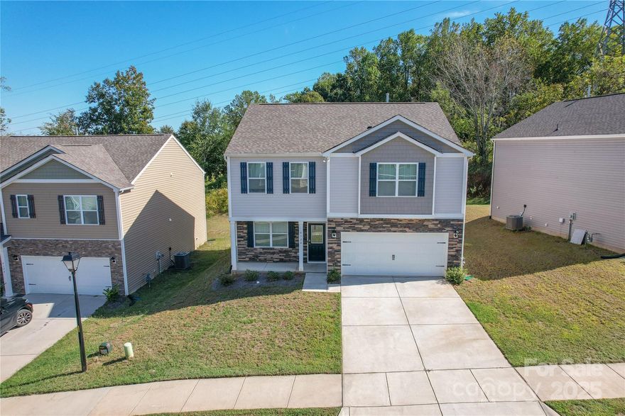 SELLERS ARE OFFERING A $10,000 CLOSING COST CREDIT, 1YR HOME WARRANTY, & ALL APPLIANCES INCLUDED!

This beautiful 3BR/2.5BA home in the highly sought-after Cline Village community, built in 2023 with 2,175 sq ft of stylish, functional living space. This modern two-story home features an open floor plan with luxury vinyl plank flooring throughout the main level, a spacious living room, and a bright dining area. The gourmet kitchen boasts granite countertops, stainless steel appliances, a large center island with bar seating, tile backsplash, and a walk-in pantry. Upstairs, you’ll find a versatile loft space—perfect for a home office, playroom, or media area—alongside a convenient laundry room and two secondary bedrooms with ample closet space. The expansive primary suite offers a peaceful retreat with a tray ceiling, dual vanity, soaking tub, tiled shower, private water closet, and walk-in closet. Exterior highlights include a covered front porch, 2-car garage, and a flat 0.18-acre lot. Neighborhood offers sidewalks and green space. Conveniently located minutes from I-40, downtown Conover, shopping, dining, and just a short drive to Hickory and Newton. Move-in ready and loaded with upgraded finishes!