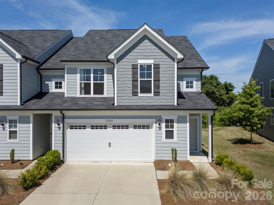 END-UNIT townhome in the Pringle Towns community in Steele Creek just minutes from Charlotte Premium Outlets, dining, entertainment, and convenient interstate access. This spacious 3-bedroom, 2.5-bath home features a bright, open-concept floor plan and has brand new carpet installed upstairs. The main level showcases stylish laminate flooring throughout, a spacious Great Room, dining area, and an upgraded kitchen complete with stainless steel appliances, 42” cabinetry, quartz countertops, designer backsplash, pendant lighting, and modern hardware. Step outside to enjoy the private rear patio backing up to trees. Upstairs features brand new carpet throughout and a spacious Owner’s Suite offering a luxurious retreat with a walk-in tiled shower, upgraded quartz vanity countertops, tile flooring, and upgraded cabinetry. Two additional bedrooms, a full secondary bathroom with upgraded finishes, and a conveniently located laundry room complete the second level.As an end unit, this home offers additional windows and abundant natural light throughout. Additional upgrades include crown molding, detailed window trim, and thoughtful designer touches throughout the home. Residents of Pringle Towns enjoy a resort style community pool and cabana. Move-in ready and loaded with upgrades — this is a must-see!