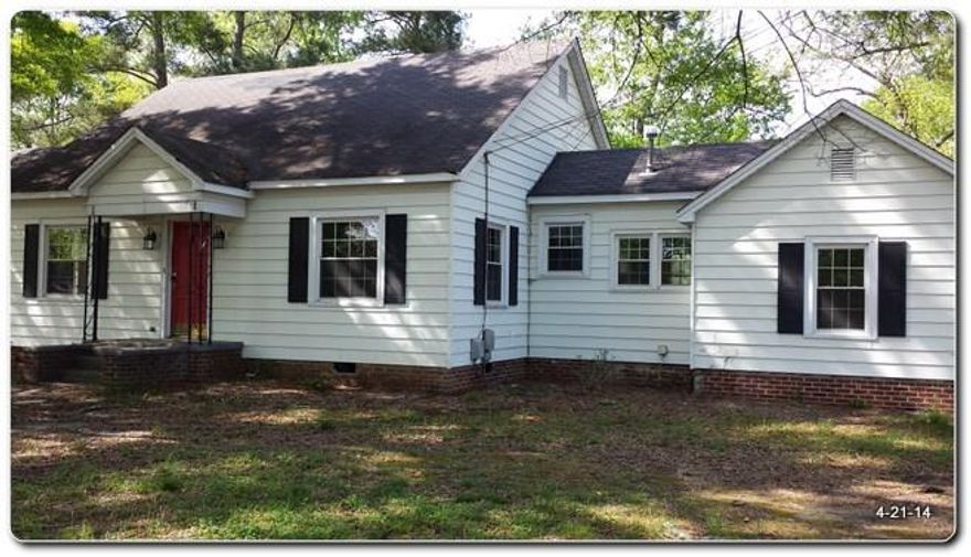 Charming 1 story Ranch Home w/ porch, deck & outbuilding, located near the center of Clover, NC. Spacious wood floor living w/ a fireplace. Roomy kitchen w/ plenty of cabinetry & a staircase to huge attic. Two good size bedrooms and 1 full bath. There's also sunroom/sewing & dining rooms. Beautiful view of a level backyard from a rear deck.