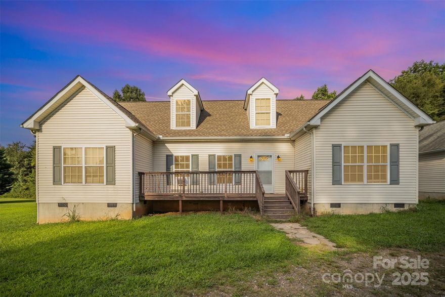 Great location with spacious open floor plan! The home features a seamless layout combining the living room, dining area, and kitchen filled with ample cabinetry-perfect for modern living and entertaining. The Primary bedroom is privately situated on one side of the house for added comfort.  A separate laundry room leads directly to the detached garage for added convenience. Upstairs, you'll find a generous family room, two versatile bonus -rooms, and an almost completed full bath-ideal for expanding your living space or creating a home office, guest area, or media room.  Home is currently being used as a 5BRs, but septic is for 3 BRs.  Located close to I-77 and the thriving Troutman community, this home offers lots of space and outstanding value.  Don't miss out on this great buy!