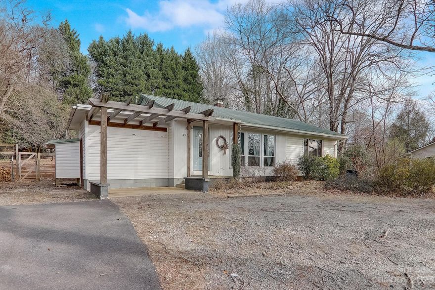 Charming 2 bedroom, 1 bathroom bungalow conveniently located near downtown Columbus. A spacious living room welcomes you with lots of natural light and hardwood floors throughout. An inviting flow leads you through the dining area and cute kitchen where you have views and access to the spacious backyard area. Raised garden beds, a large outdoor deck, a firepit, and a fully fenced in backyard make this home a perfect spot for homesteading or entertaining. Extra outdoor storage space for recreational gear or gardening tools. Easy access to I-26, while also enjoying the peace and quiet of a quaint residential neighborhood.