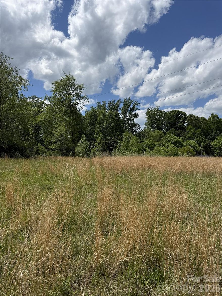 1.76 acre lot with old mobile home on it. Power lines run through the property, see attached plat for reference. Septic permit on file for a 2 bedroom system. Enter at your own risk - there are holes in some parts of the floor and the stairs to the door are old. Selling in "as is" condition.