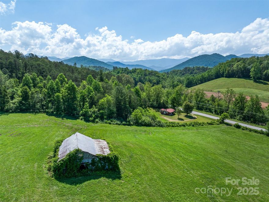 Nestled just 25 minutes from the vibrant culture of downtown Asheville and only 5 miles from the future I-26, this extraordinary 102± acre property presents a once-in-a-lifetime opportunity to create a private luxury estate, equestrian retreat, or visionary development. Commanding a premier position in the landscape, the property features a gently elevated knoll offering sweeping 180°+ panoramic views—perfectly positioned for a future main residence or event venue. With multiple potential homesites and a network of roadbeds ready to be reimagined as scenic walking or riding trails, the possibilities here are as expansive as the land itself. A rustic tobacco barn also remains, echoing the area's rich agrarian history—please note, it is not safe for entry. Whether you're seeking the ultimate mountain getaway or a safe investment in one of the Southeast's most sought-after regions, this exceptional land must be experienced to be fully appreciated.  Call Frank for a tour.