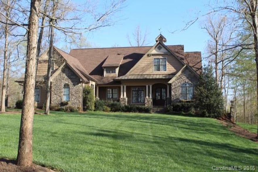 Beautiful Custom home with a seasonal waterview of the lake.Private wooded lot.Designer Kitchen opens to Keeping Rm w/one of two fireplaces in home.Walk in Pantry,Big island,SS appliances, pot filler over the 6 gas burner cooktop.Coffered ceiling and built in cabinets in Living Rm. Transiem windows at doorways.Stunning Master has dbl tray ceiling, pedestal bathtub and walk in tiled shower.Entertain in the Media/Rec Room with wet bar and mini fridge.Possible mother in law suite on upper floor.