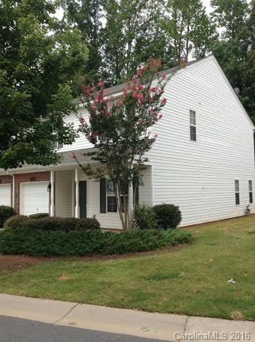 Great updated large end unit townhouse with single car garage in Fort Mill school district!  Fresh paint and new updated light fixtures. Open concept kitchen with new stove opens into family area with fireplace. Refrigerator comes with unit. Bedroom on main with bath - accessed from bedroom or great-room.  2 additional bedrooms and large media area upstairs. Large utility room upstairs and comes with washer and dryer.  Unit backs up to woods with privacy.  Very easy access to I-77.