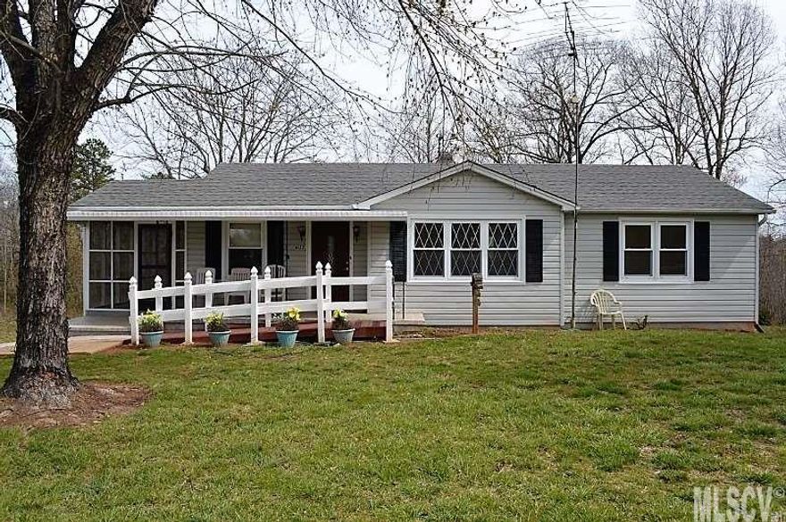 Lots of updates on this cute ranch with basement!  This 3BR/1BA home has fresh paint throughout, refinished hardwood floors, updated fixtures in bathroom, newer vinyl, roof in 2015 and heat pump in 2016.  Tons of natural light.  All appliances stay, including washer and dryer!  Relax and watch the wildlife from your screened side porch or rocking chair front porch.  Fruit trees and grape vines on property.  Comes with two additional parcels totaling 6.02 acres.  Steady flowing creek borders the property.  Conveniently located 20 minutes from Hickory, Lincolnton and Morganton.